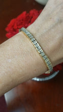 Load and play video in Gallery viewer, 5 CT. T.W. PRINCESS CUT DIAMOND TENNIS BRACELET in 14K YELLOW GOLD

